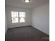 Bedroom with a view from the window and neutral carpet at 222 Harpers Run Ln, Matthews, NC 28104