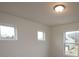 A bright bedroom with three windows offering ample natural light at 222 Harpers Run Ln, Matthews, NC 28104