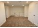 Spacious carpeted bonus room with a railing and two doors at 222 Harpers Run Ln, Matthews, NC 28104