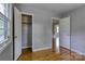 Bedroom view with hardwood floors and open closet space at 24 19Th Nw St, Hickory, NC 28601