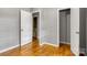 Bedroom featuring hardwood floors with doorways that lead to a bathroom and closets at 24 19Th Nw St, Hickory, NC 28601