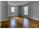Bedroom featuring hardwood floors and neutral walls, illuminated by natural light at 24 19Th Nw St, Hickory, NC 28601