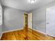 Bedroom with hardwood floors and neutral walls, showing the doorway to the hall and the closet at 24 19Th Nw St, Hickory, NC 28601