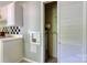 Laundry area with washer-dryer hookups and storage shelves, offering a practical space for laundry needs at 24 19Th Nw St, Hickory, NC 28601