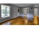 Sunlit living room boasting hardwood floors and an open layout leading to other rooms at 24 19Th Nw St, Hickory, NC 28601