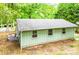 This home features a side view with a neutral color palette and a durable roof at 24 19Th Nw St, Hickory, NC 28601