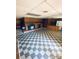 Spacious basement featuring unique checkered flooring and a brick fireplace at 2405 Forrestbrook Dr, Kannapolis, NC 28083