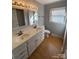 Bright bathroom with a double sink vanity and updated lighting fixtures at 2405 Forrestbrook Dr, Kannapolis, NC 28083
