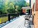 Inviting outdoor deck with dark railing and comfortable seating for relaxing and enjoying backyard view at 2405 Forrestbrook Dr, Kannapolis, NC 28083