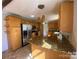 Charming kitchen with granite countertops, stainless steel appliances, and wooden cabinets at 2405 Forrestbrook Dr, Kannapolis, NC 28083