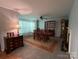 Spacious living room showcasing classic furnishings, fireplace, and elegant décor at 2405 Forrestbrook Dr, Kannapolis, NC 28083