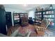 Comfortable living room with large bookshelves, two chairs, and a decorative rug at 2405 Forrestbrook Dr, Kannapolis, NC 28083