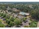 Aerial view of community clubhouse and outdoor pool surrounded by trees at 26444 Sandpiper Ct, Fort Mill, SC 29707