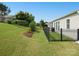 Spacious backyard features a black fence, patio, and lush green lawn with attractive landscaping at 26444 Sandpiper Ct, Fort Mill, SC 29707
