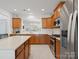 Bright kitchen featuring stainless steel appliances, an island, and eat-in dining area at 26444 Sandpiper Ct, Fort Mill, SC 29707