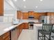 Bright kitchen featuring stainless steel appliances, an island, and eat-in dining area at 26444 Sandpiper Ct, Fort Mill, SC 29707