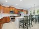 Bright kitchen featuring stainless steel appliances, an island, and eat-in dining area at 26444 Sandpiper Ct, Fort Mill, SC 29707