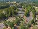 Aerial view of the community tennis and bocce ball courts with surrounding lush trees and landscaping at 26444 Sandpiper Ct, Fort Mill, SC 29707