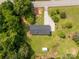 Aerial view of a cozy home with a shed and a sprawling yard surrounded by lush trees at 279 Bailey Rd, Lancaster, SC 29720