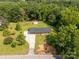 Aerial view of a cozy home surrounded by lush greenery, a long driveway, and a charming shed at 279 Bailey Rd, Lancaster, SC 29720