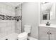 Bathroom featuring white tiled shower and vanity with black faucet and hardware at 279 Bailey Rd, Lancaster, SC 29720