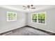 Well-lit bedroom with carpet and large windows at 279 Bailey Rd, Lancaster, SC 29720