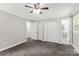 Bedroom with two closets, neutral walls, trim, carpet and access to ensuite bath at 279 Bailey Rd, Lancaster, SC 29720