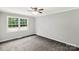 Comfortable bedroom with a ceiling fan and a large window at 279 Bailey Rd, Lancaster, SC 29720