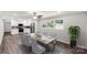 Dining room and kitchen area with seating for six, modern appliances, and hardwood floors at 279 Bailey Rd, Lancaster, SC 29720