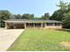 Charming ranch-style home with a covered carport and well-maintained lawn at 279 Bailey Rd, Lancaster, SC 29720