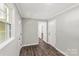 Clean hallway with wood-look flooring and neutral paint at 279 Bailey Rd, Lancaster, SC 29720