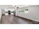 Open concept kitchen, white cabinets, stainless appliances, and hardwood flooring at 279 Bailey Rd, Lancaster, SC 29720