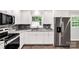 Well-lit kitchen showcasing granite countertops, stainless steel appliances, and white cabinets at 279 Bailey Rd, Lancaster, SC 29720