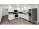 Bright kitchen featuring stainless steel appliances, granite countertops, and a stylish tile backsplash at 279 Bailey Rd, Lancaster, SC 29720