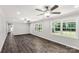 Spacious living room with wood floors, neutral paint, ceiling fans and large windows at 279 Bailey Rd, Lancaster, SC 29720