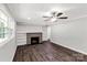 Inviting living room featuring a brick fireplace, built-in shelving, and plenty of natural light at 279 Bailey Rd, Lancaster, SC 29720