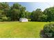 View of the shed in the large, grassy back yard at 279 Bailey Rd, Lancaster, SC 29720