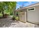Exterior view of home with storage shed and gravel area at 2813 Hilliard Dr, Charlotte, NC 28205