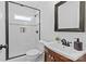 Modern bathroom with white subway tile, glass shower and updated vanity at 2813 Hilliard Dr, Charlotte, NC 28205