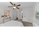 A bedroom featuring a ceiling fan, neutral paint, carpeted floor, furniture, and doors at 2813 Hilliard Dr, Charlotte, NC 28205