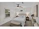 This is a decorated bedroom with neutral paint, a ceiling fan, and a window at 2813 Hilliard Dr, Charlotte, NC 28205