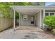 Attached covered parking area with easy access to a side entrance door, and adjacent yard at 2813 Hilliard Dr, Charlotte, NC 28205