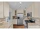 Modern kitchen with stainless steel appliances, granite countertops, and stylish cabinetry at 2813 Hilliard Dr, Charlotte, NC 28205