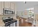 Open-concept kitchen with granite counters, a breakfast bar, and seamless access to the living space at 2813 Hilliard Dr, Charlotte, NC 28205