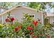 Vibrant red roses in front of a charming home, enhancing its curb appeal at 2813 Hilliard Dr, Charlotte, NC 28205