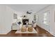 Bright and open living room with wood floors, comfortable seating, and natural light at 2813 Hilliard Dr, Charlotte, NC 28205