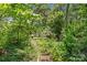 Secluded path leading through lush greenery, offering a tranquil and private outdoor retreat at 2813 Hilliard Dr, Charlotte, NC 28205