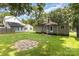 Charming backyard featuring a stone patio and a detached building at 2819 Georgia Ave, Charlotte, NC 28205