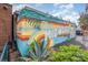 Vibrant mural of 'Plaza Midwood' adorns the side of a building, adding a colorful and artistic touch to the local landscape at 2819 Georgia Ave, Charlotte, NC 28205