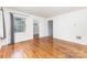 Sunny living room with hardwood floors, fresh paint, and backyard views at 2819 Georgia Ave, Charlotte, NC 28205